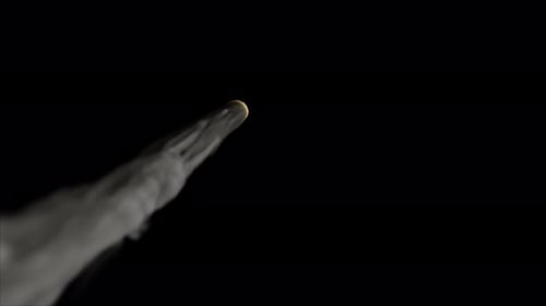 Burning Meteorite with Smoke Trail in Dark Space
