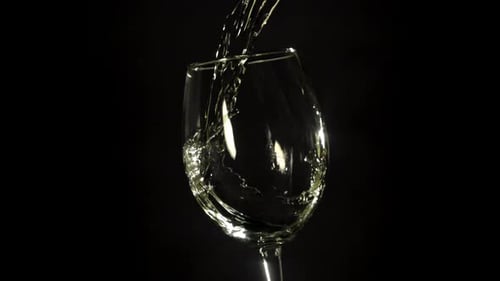 White Wine is Poured Into a Glass Filmed on a Highspeed Camera at 1000 Fps