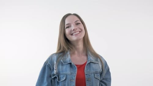 Woman Smiles, Arms Up in Celebration