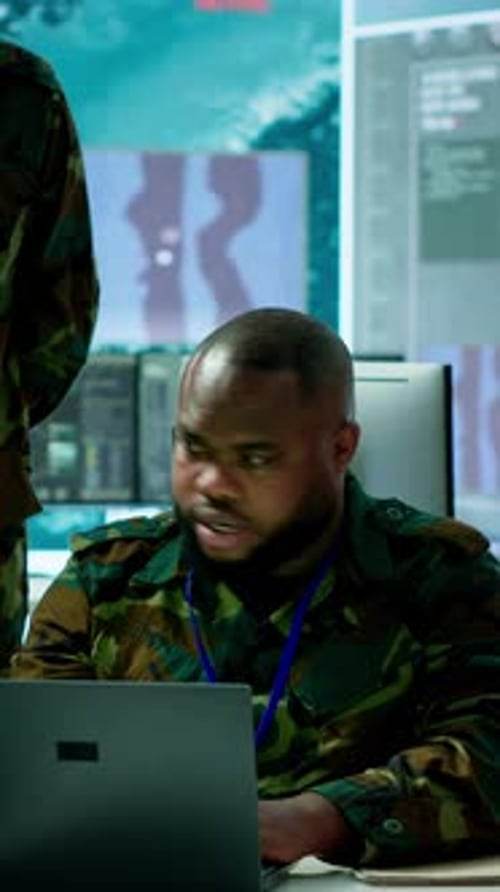 Vertical Video Military Personnel in a Modern Command Center Handle Critical Information