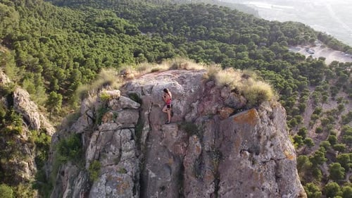 Climbing woman in the mountain. Drone view of climber sportsmen.Physical activity in the countryside