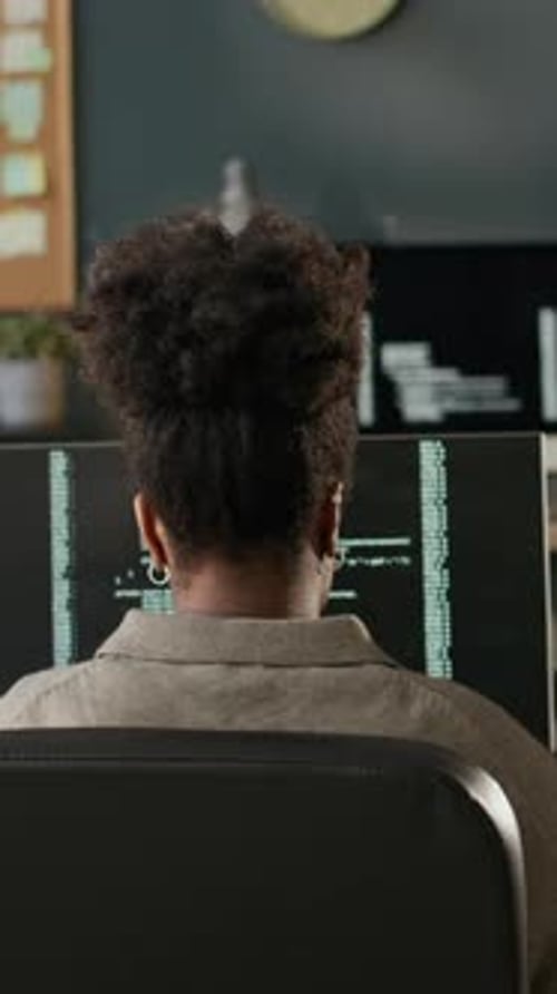 Vertical of Black Female Software Developer Working in Programmers Office