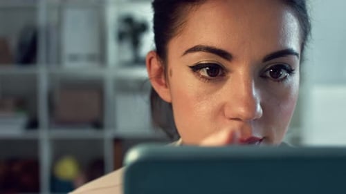 Young business woman, tablet and in office for online reading, search internet