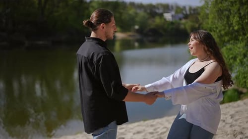 Young Couple Enjoying a Romantic Day by the River