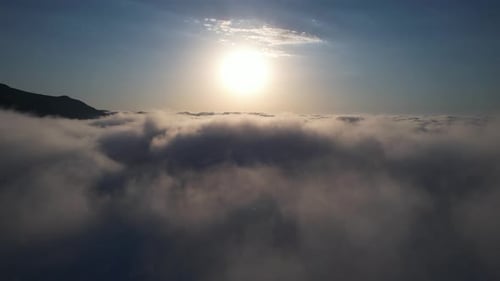 Aerial View Above Clouds at Sunrise or Sunset