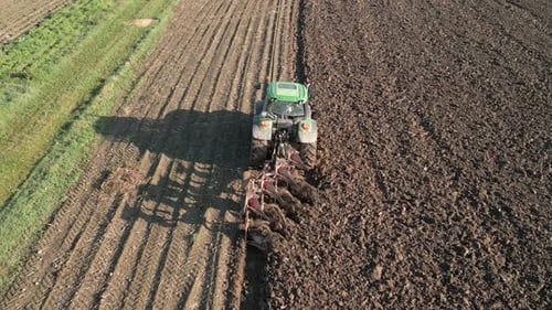 Tractor Plows Land In The Field Aerial