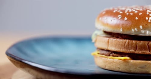 Double Cheeseburger on a Blue Plate