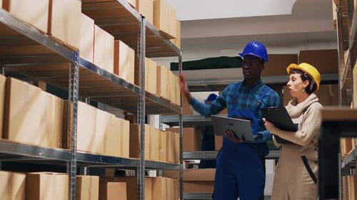 Two Depot Workers Doing Inventory for Warehouse Goods