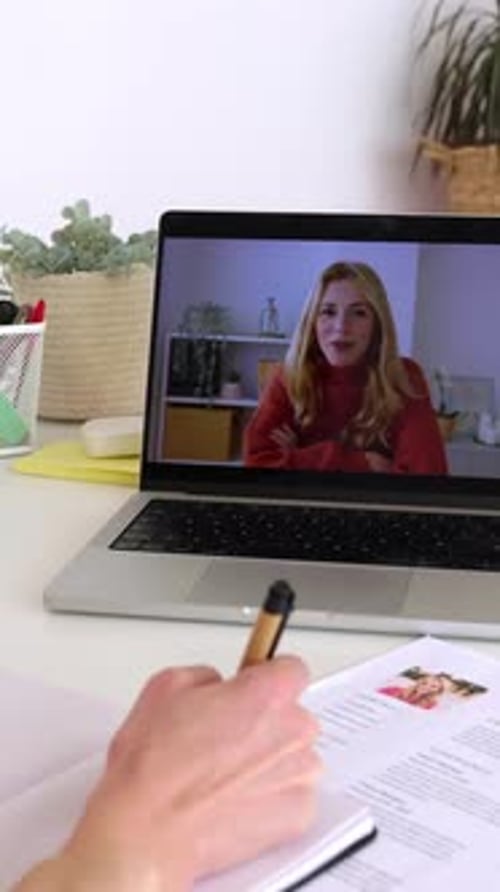 Female HR Recruiter Talking with Job Applicant By Laptop Video Call at Office