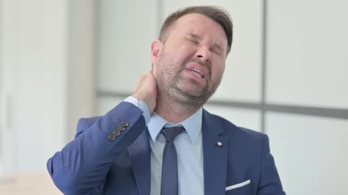 Businessman Experiencing Intense Neck Pain