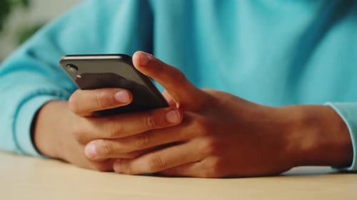 Close Up of Hands Using a Smartphone