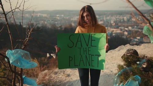 Shot of Woman Activist Holding Encouraging Green Poster Save the Planet Standing Background