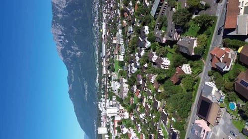 View of the Swiss city Werdenberg. Swiss Alps in the background. Roofs of houses