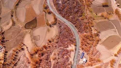 Aerial view of winding road in Drass farming land