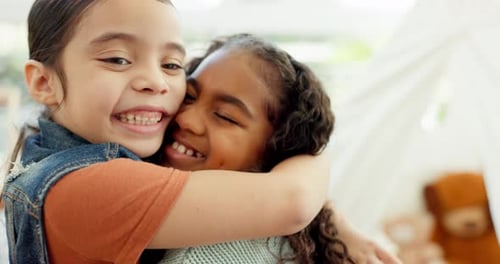 Two Young Girls Enjoying a Happy Hug