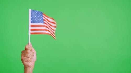 Hand Holding American Flag on Green Screen