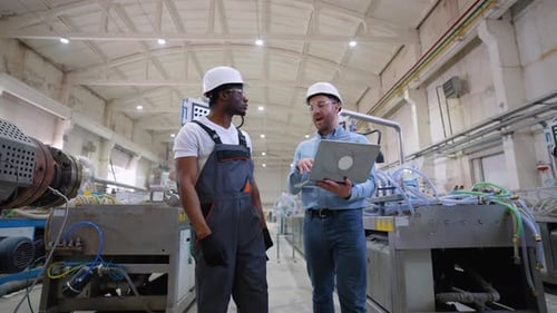 Two Workers Walking and Check the Cooling System of the Production Line
