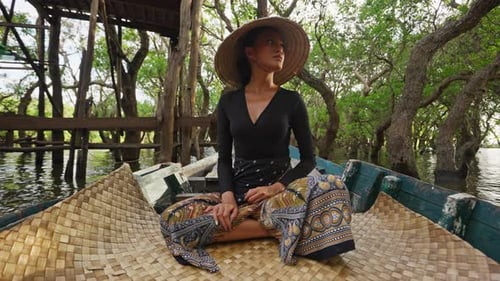 Woman in Boat, Flooded Forest, Traditional Asian Hat