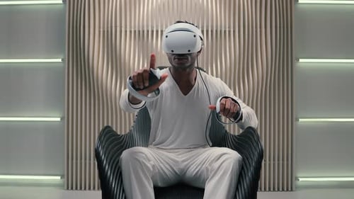 Man Using VR Headset in Futuristic Room