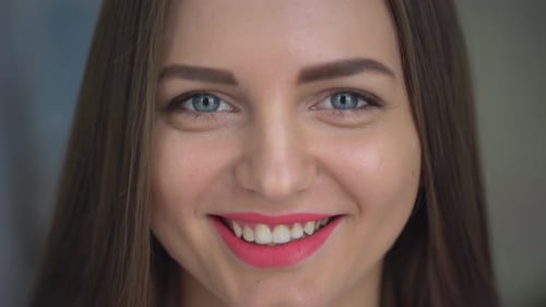 Smiling Woman in Close-Up Portrait Looking at Camera