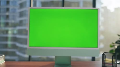 Green Screen Template Monitor at Modern Workplace Closeup. Mockup Pc Computer Interior
