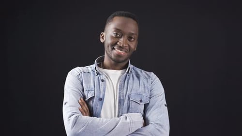 Young Adult Male Smiling Portrait with Arms Crossed