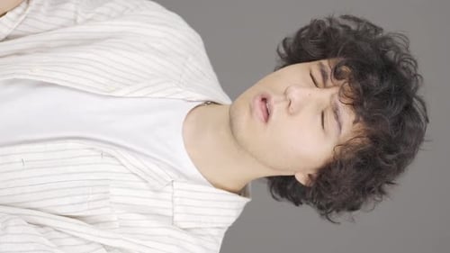 Expressive Young Adult Gesturing Enthusiastically