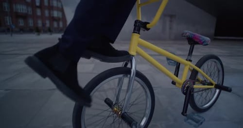 A Businessman Performs Wheel Walk On BMX Bike