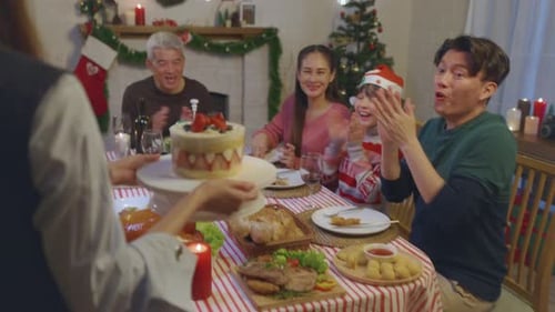 Family Celebrates Christmas with Cake and Cheer