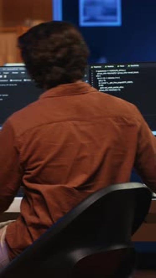 Engineer Arrives in Home Office with Coffee Mug in Hand Ready to Start Coding