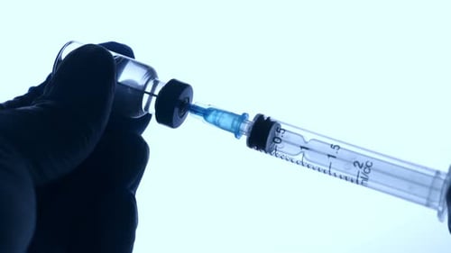 Doctor Injecting Vaccine