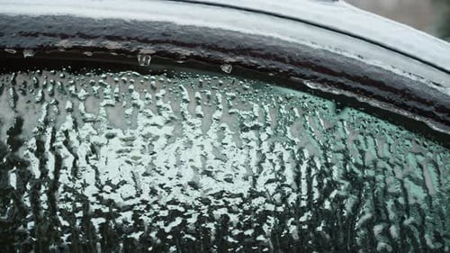 Iced Over Car Window on Cold Winter Day