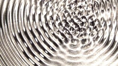 Abstract Water Ripples on Silver Surface