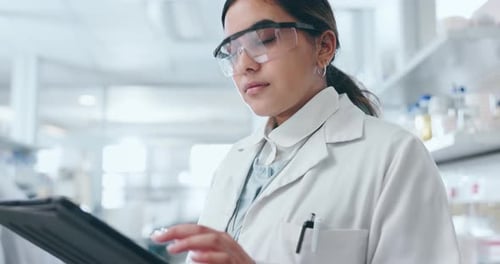Young Scientist Working with Tablet in Laboratory