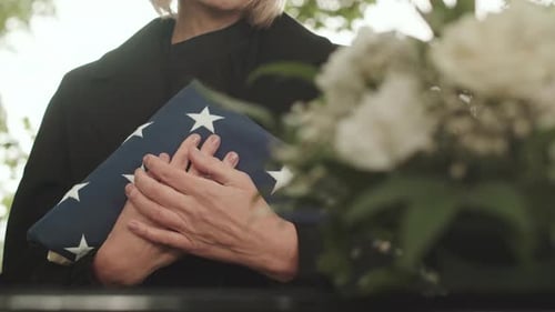 Adult Holding American Flag and Roses