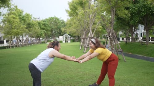 chubby women workout at garden.
