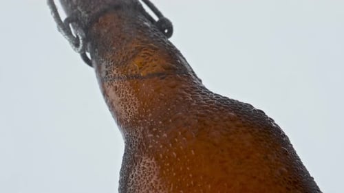 Wet Glass Beer Bottle Covered Clear Moisture Droplets on White Background Close