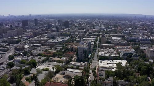 High panning aerial shot of Downtown Hollywood and Downtown Los Angeles in California. 4K