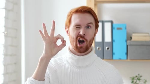 Man Giving Ok Hand Gesture and Winking