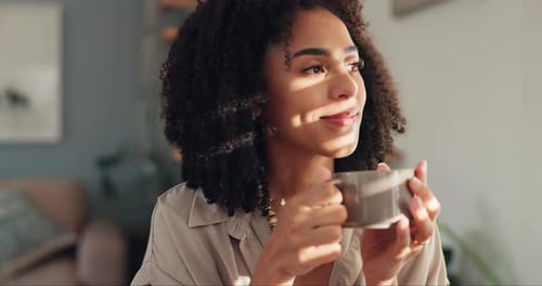 Woman Drinking Coffee in a Sunlit Home