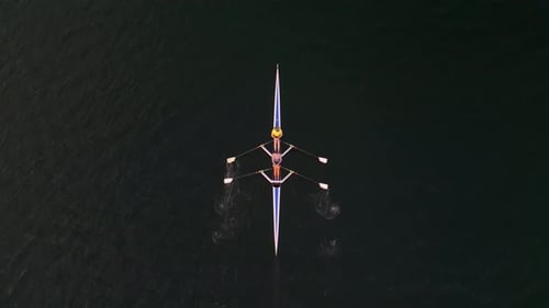 Top View Shot Drone of a Sports Rowing Boat with a Crew of Young Sportsmen