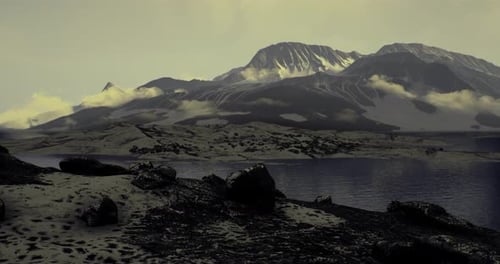 Majestic Mountain Landscape with Serene Lake During Twilight Hours