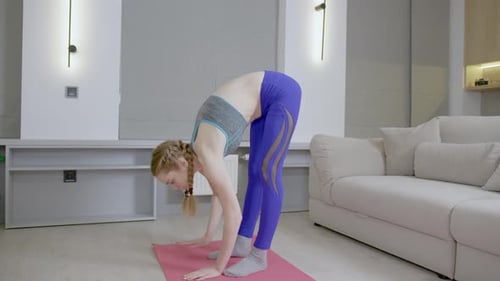 Woman Stretching During Home Fitness Workout