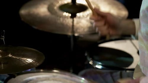 Drummer Playing the Cymbals and Drums