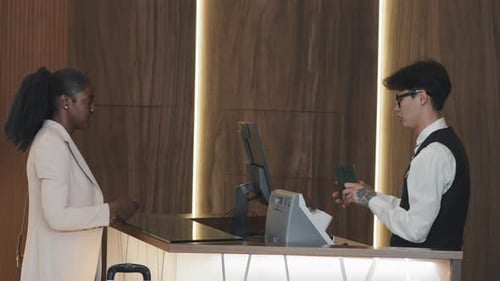 Young Black Businesswoman Getting Room In Hotel