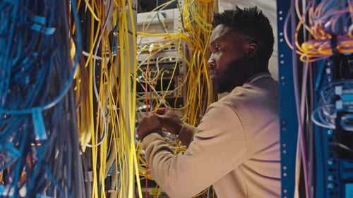 IT Technician Working in a Server Room