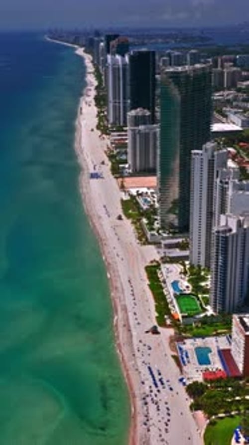 Aerial view of Miami Beach showcases sandy coastline and skyline