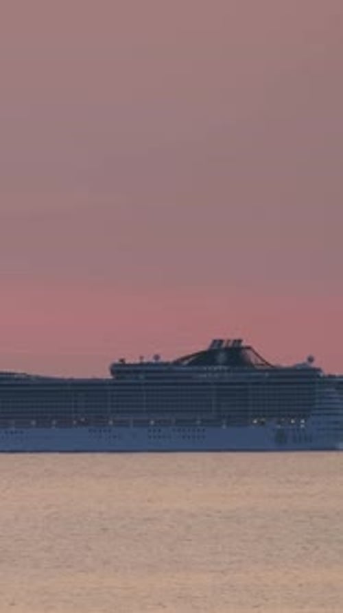 Cruise Ship Sail in Sea on Sunset with Sun
