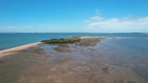 Aerial view of coastal landscape with greenery and beach, Australia.