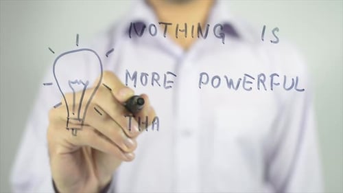 Drawing Lightbulb and Idea on Clear Surface